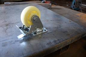 Close-up of a high-quality caster wheel with a brake mechanism.