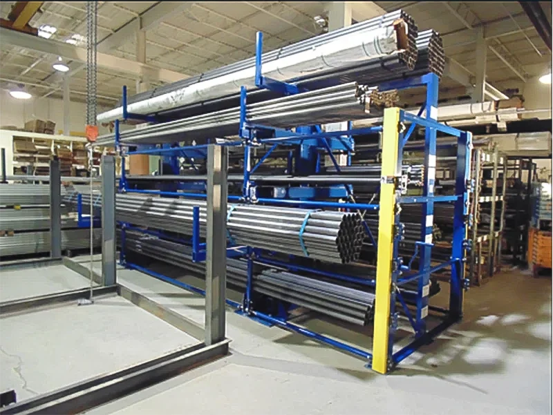 Blue single-sided roll out cantilever rack storing heavy steel pipes and tubes efficiently